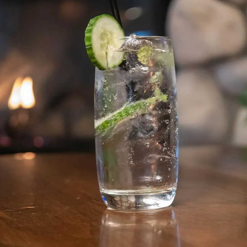 Cucumber cocktail by the fireplace.